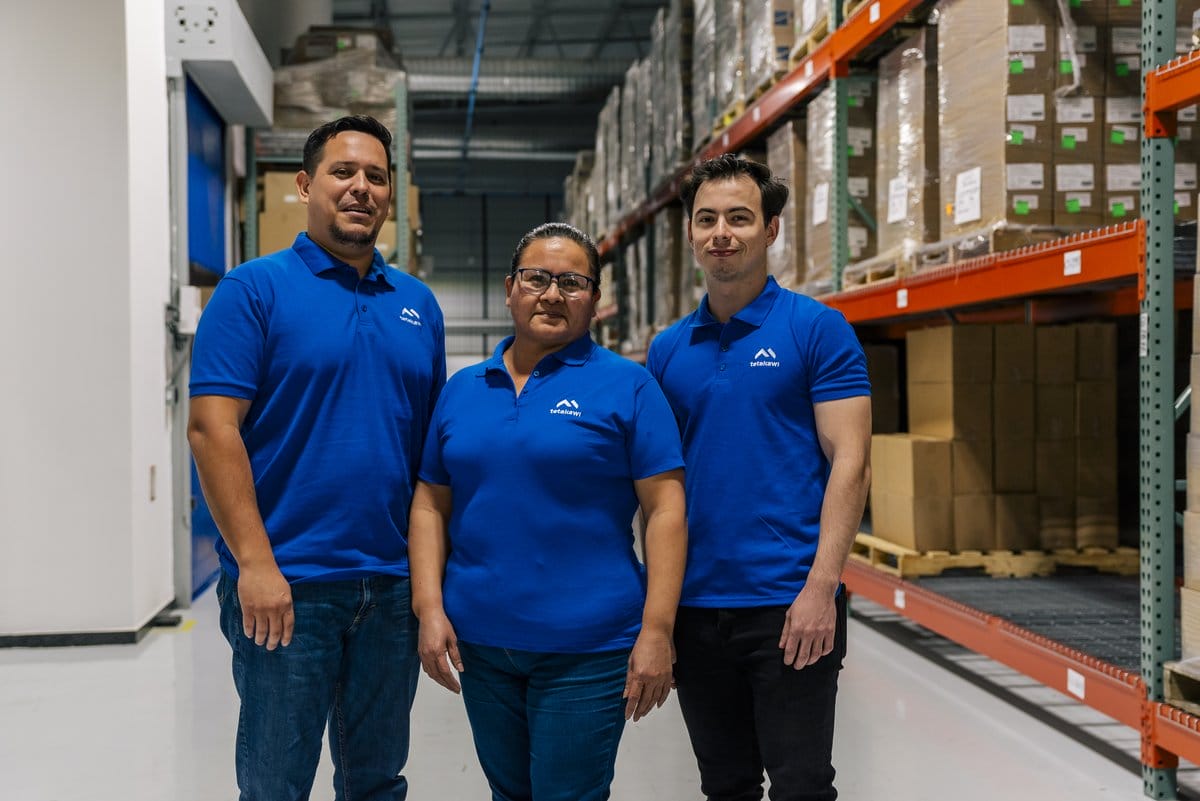 Tetakawi team members in a warehouse and logistics facility in Mexico | Tetakawi