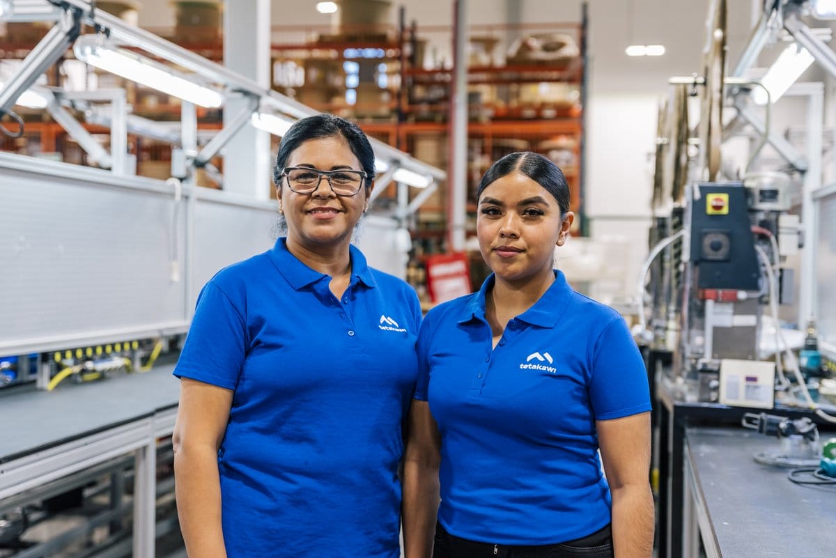 Experienced and newer Tetakawi team members together on a Manufacturing Campus production floor in Mexico | Tetakawi