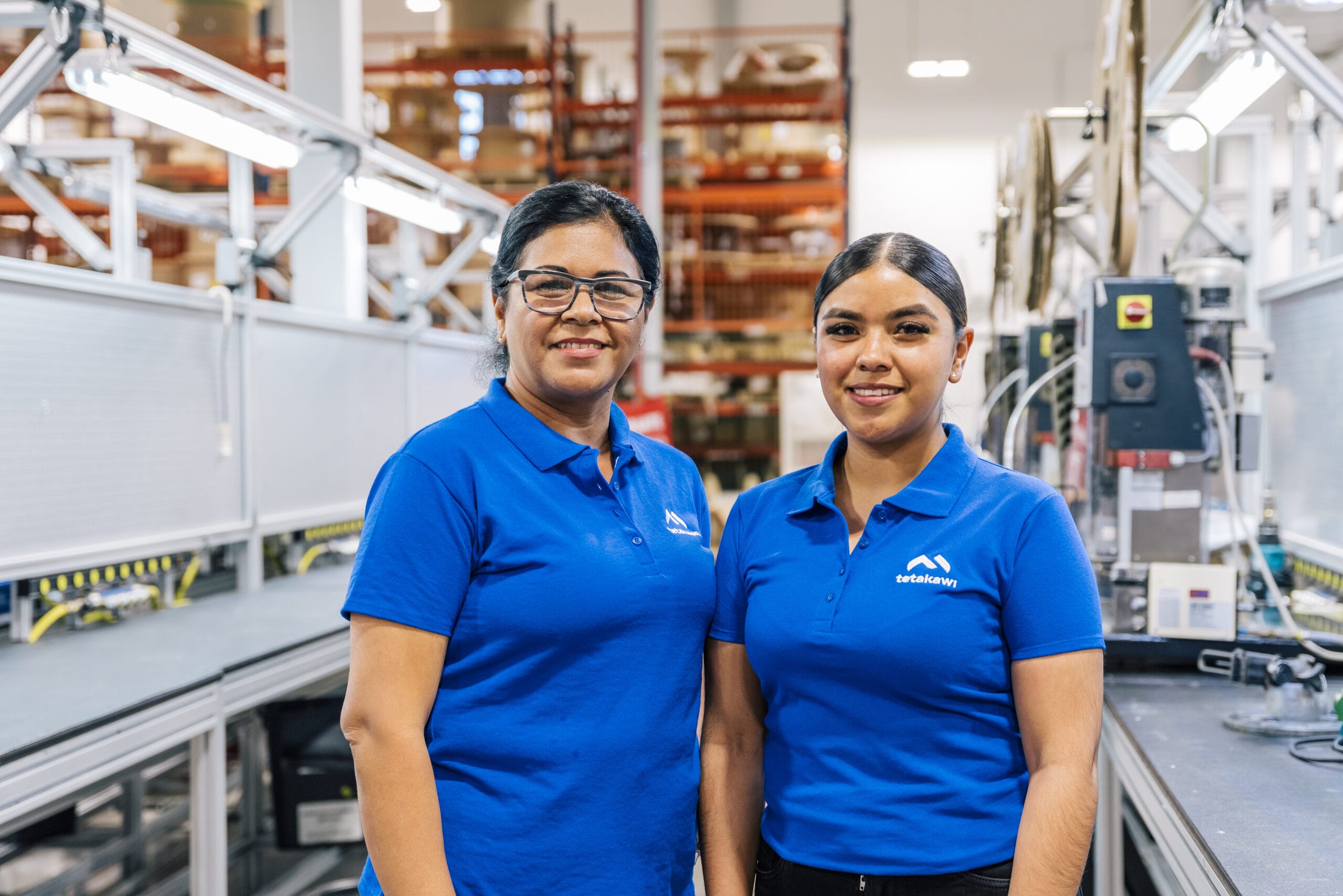 Tetakawi employees on an electronics manufacturing assembly line in Mexico | Tetakawi