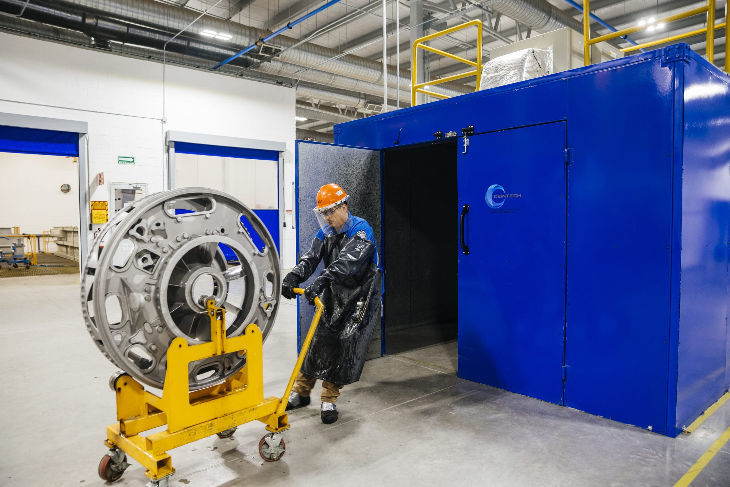 A Tetakawi technician processes an aerospace component while manufacturing in Mexico | Tetakawi