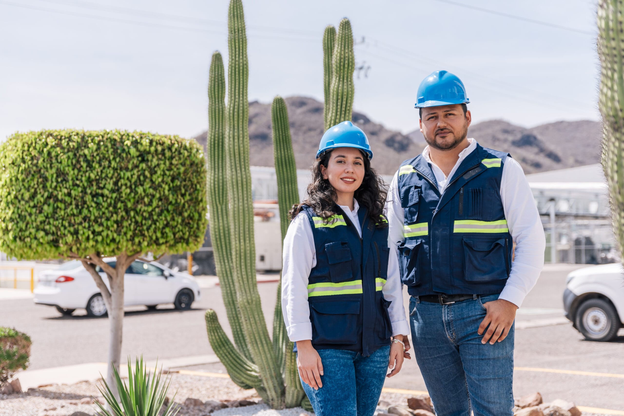 Two Tetakawi shelter services team members stand outside a Manufacturing Campus in Mexico | Tetakawi