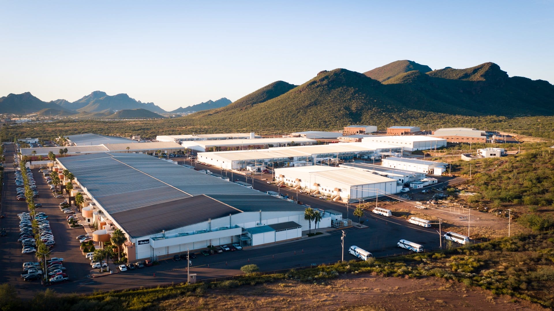 Aerial view at golden hour of a manufacturing campus in Sonora, Mexico, including the Parker Hannifin facility | Tetakawi
