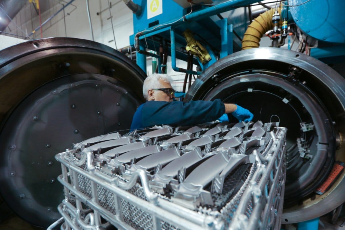 A Tetakawi technician processing metal components at a Manufacturing Campus under Mexico's IMMEX program | Tetakawi