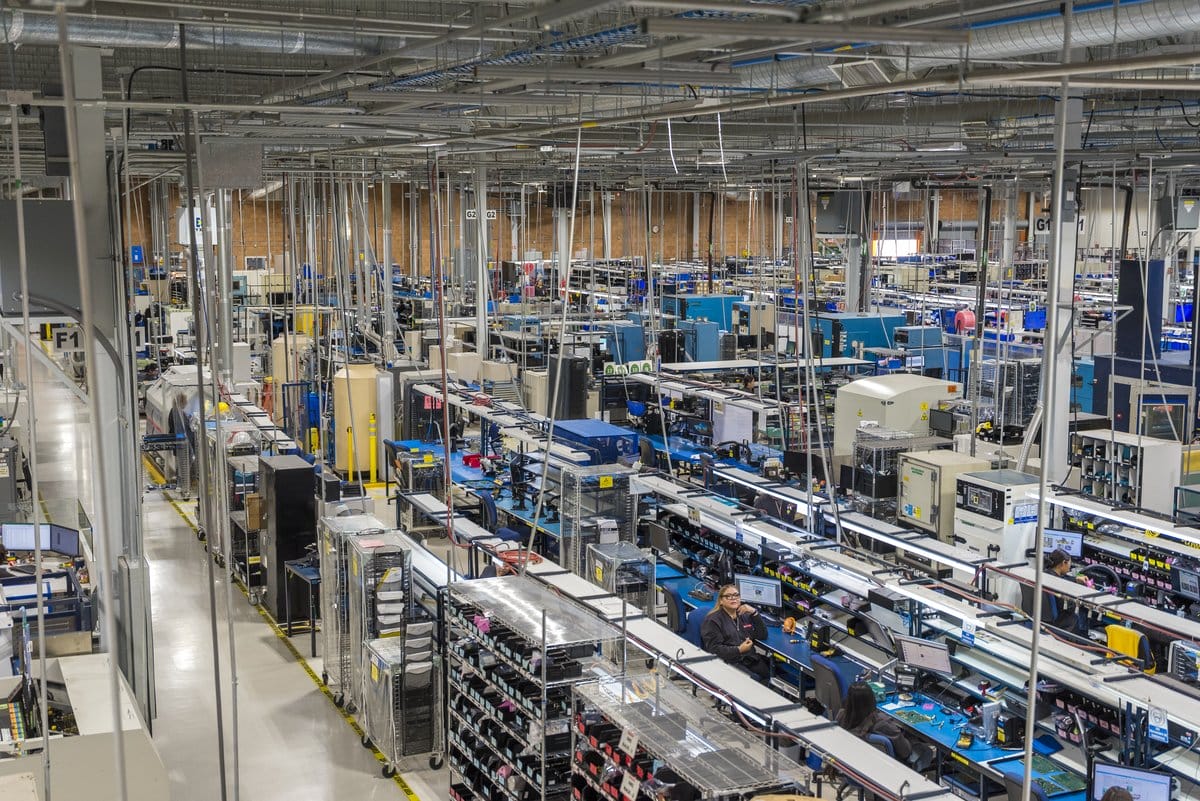 Wide view of an active manufacturing operations floor at a Tetakawi Manufacturing Campus in Mexico | Tetakawi