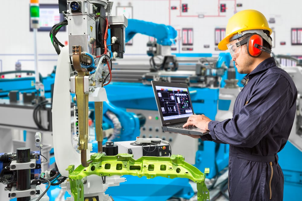 Autotmotive Manufacturing Worker Using Automated Machine