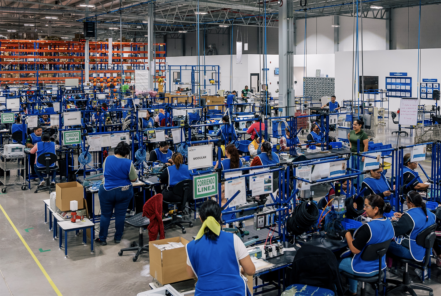 Assembly line workers at a modern maquiladora facility, reflecting Mexico's manufacturing history | Tetakawi