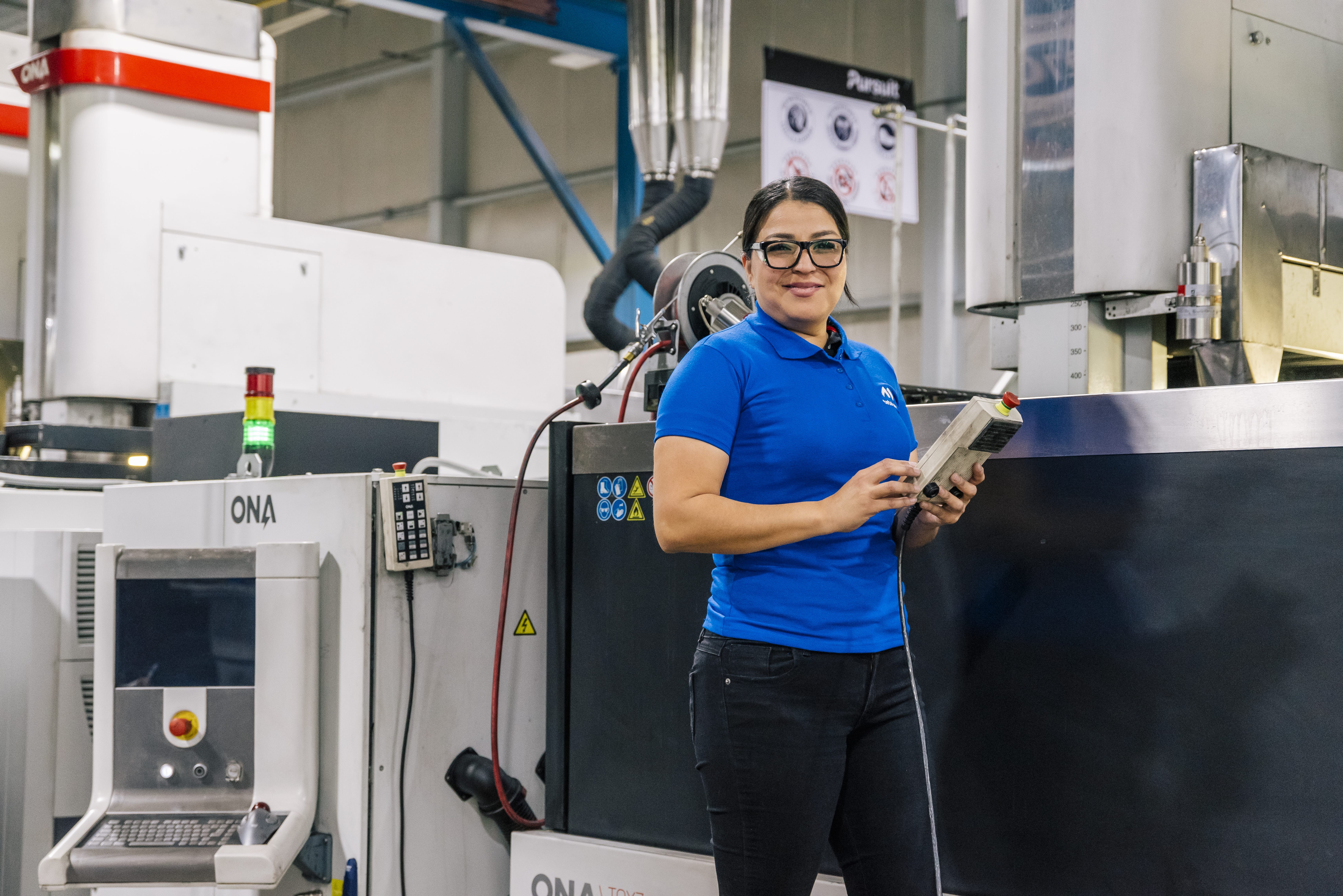 Tetakawi technician operating precision machining equipment for aerospace manufacturing in Mexico | Tetakawi