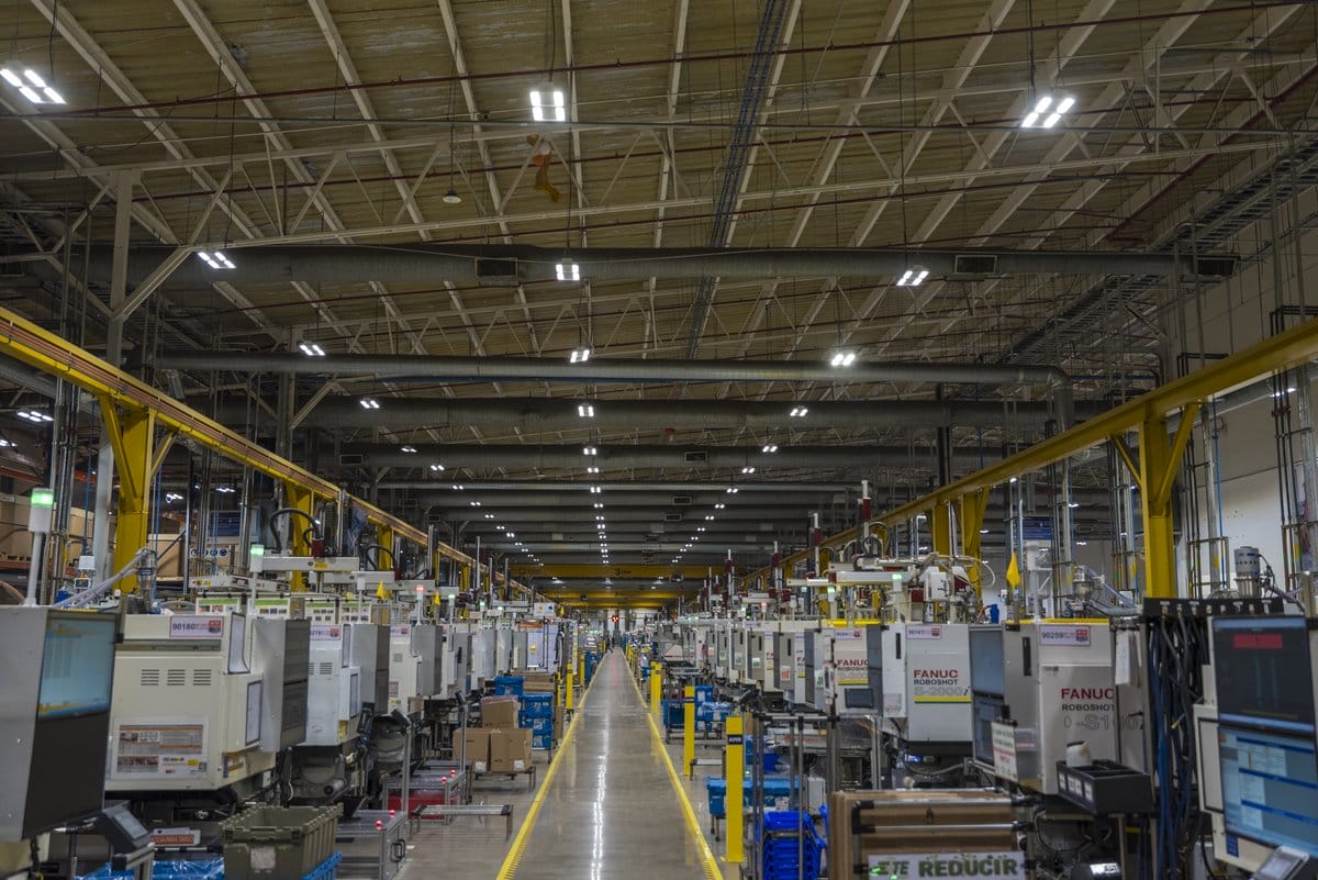 Automated injection-molding line producing automotive parts at a Tetakawi Manufacturing Campus in Mexico | Tetakawi
