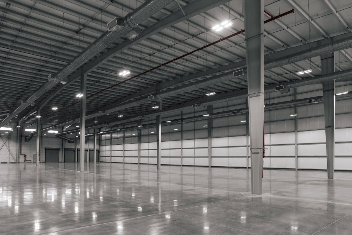 An empty, move-in-ready Tetakawi Manufacturing Campus building interior, lights on and ready for launch | Tetakawi