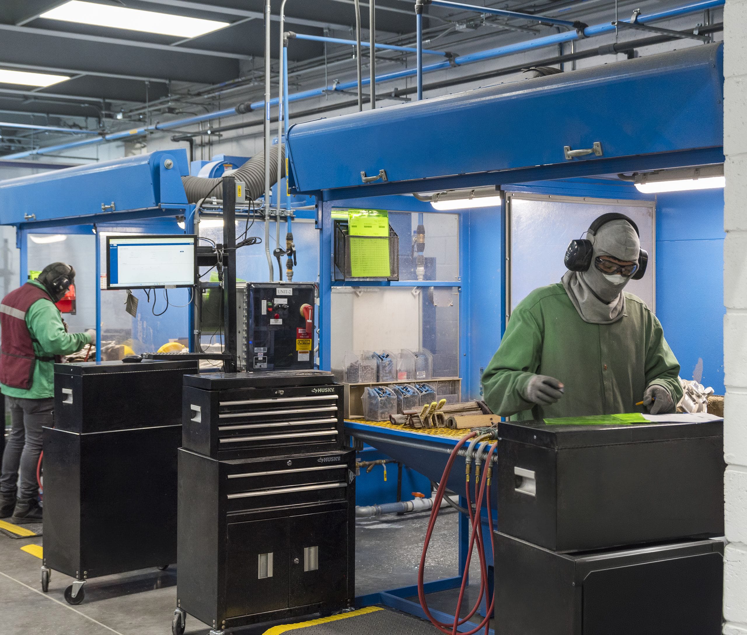 Manufacturing employees performing precision assembly work at a Tetakawi Manufacturing Campus in Mazatlán