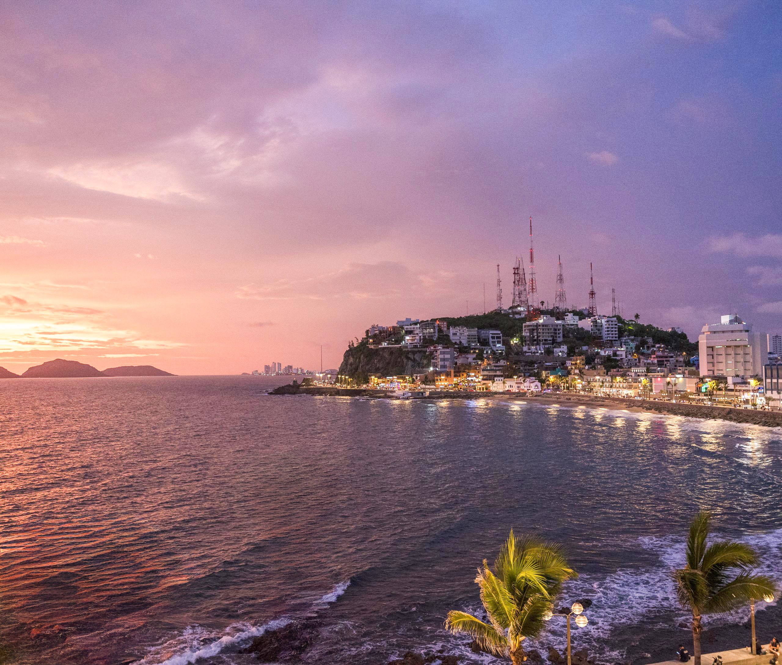 Sunset view of the Mazatlán skyline and waterfront malecón