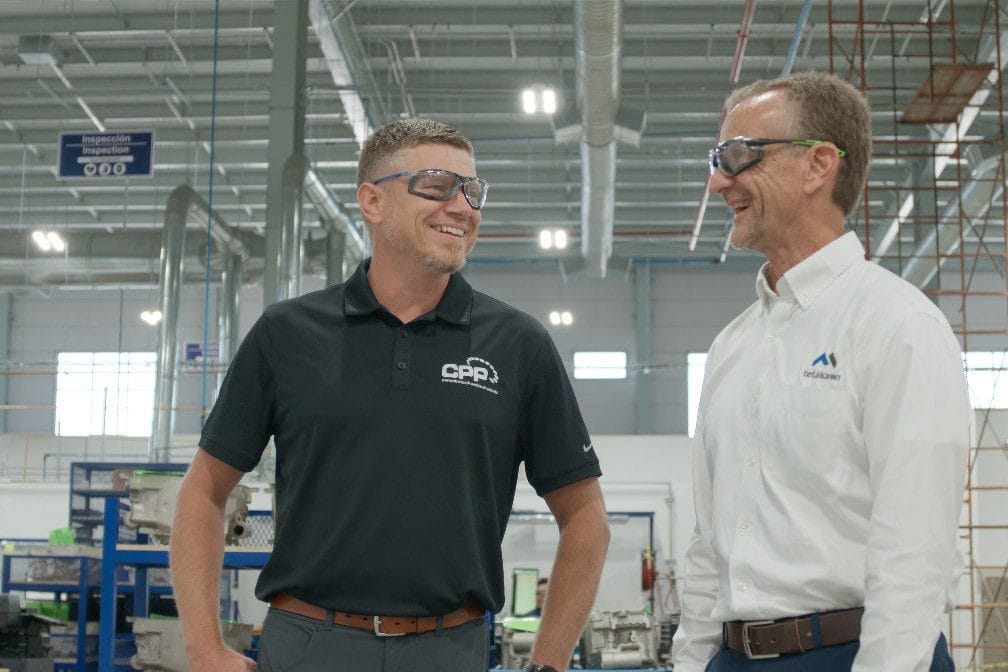 Jeremy Main, SVP at Consolidated Precision Products, on the CPP production floor with a Tetakawi team member | Tetakawi