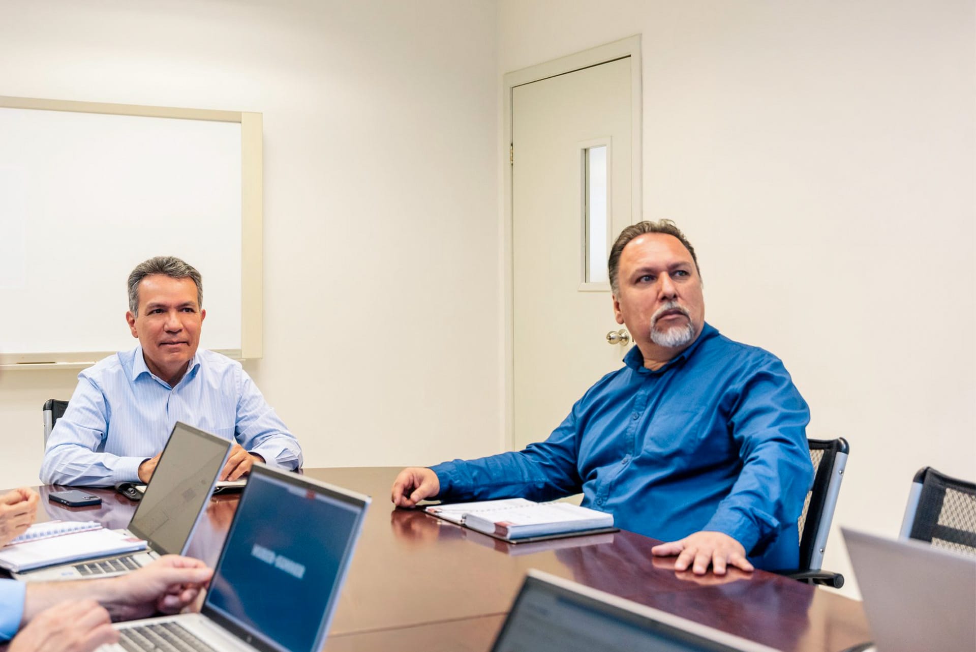Carlos Rivera, Plant Manager at HUBER+SUHNER, in a meeting