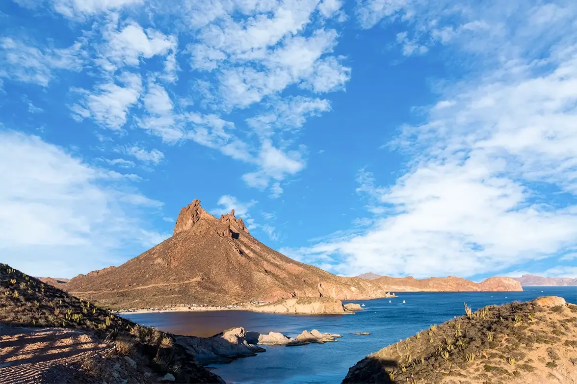 Tetakawi peak rising above the Sea of Cortez in San Carlos, Sonora, the landmark behind the company name | Tetakawi
