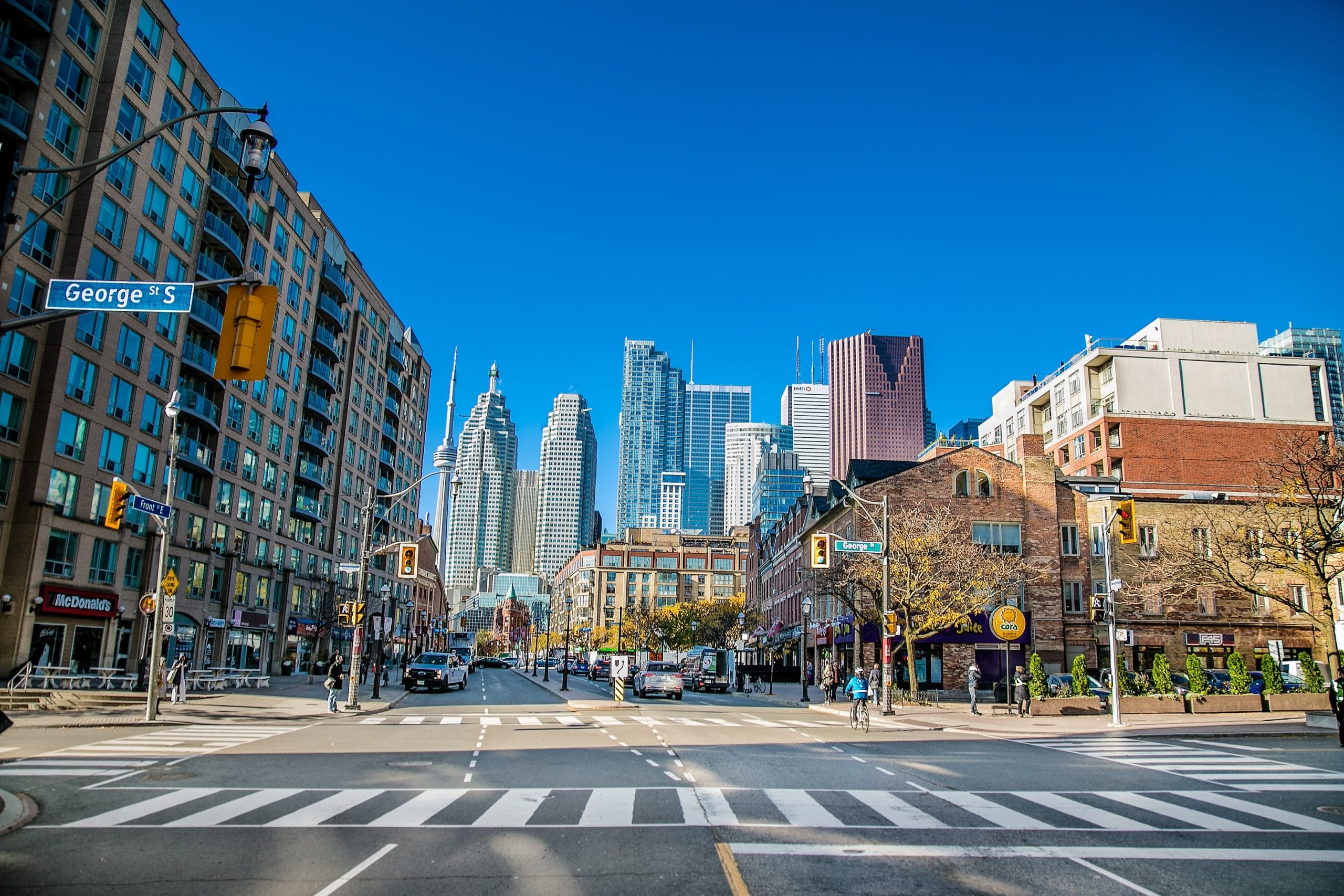 Downtown Toronto street with the CN Tower and office towers, representing Canada as a manufacturing alternative | Tetakawi