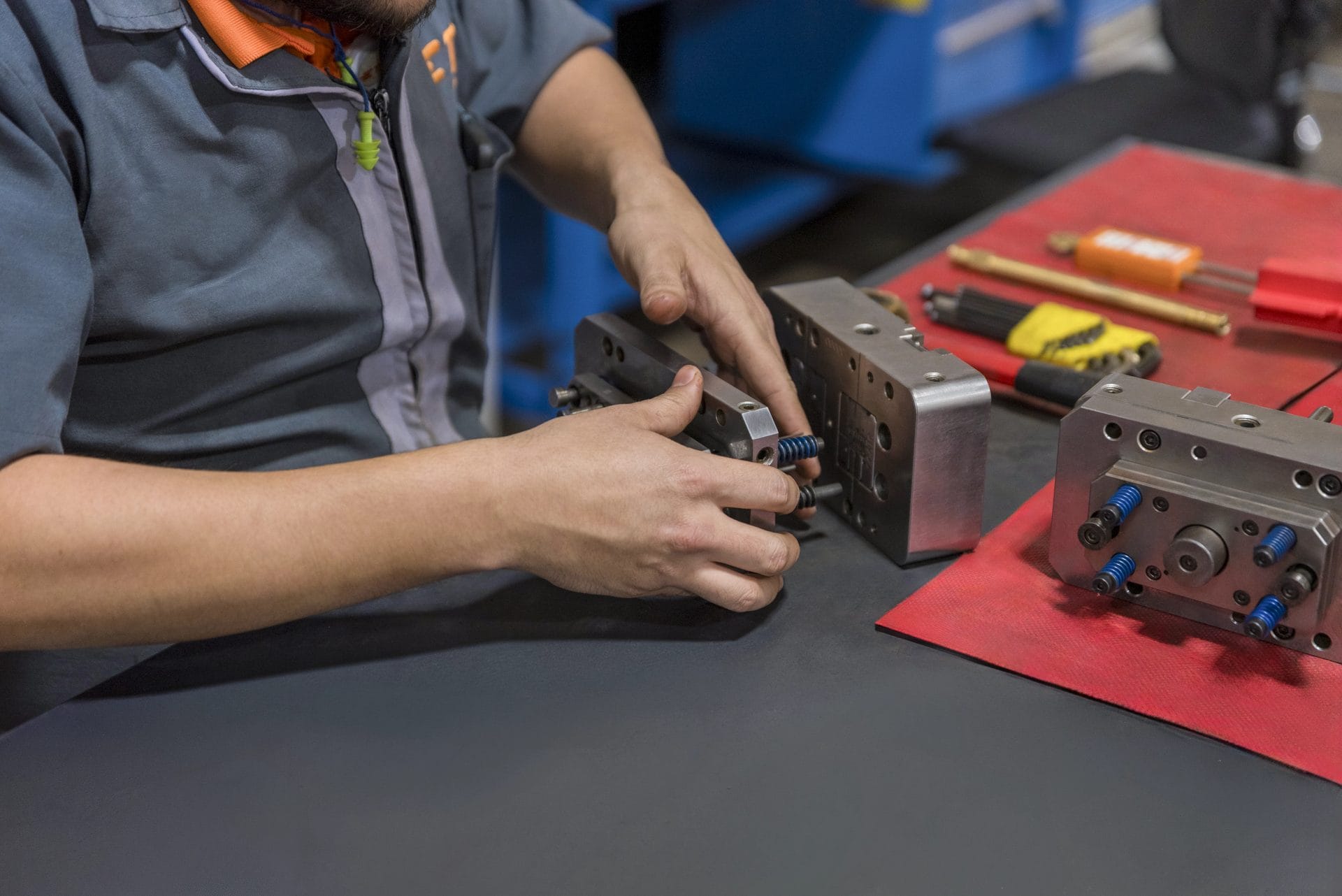 TE Connectivity technician assembling precision tooling components at Tetakawi's Bella Vista Campus in Empalme | Tetakawi