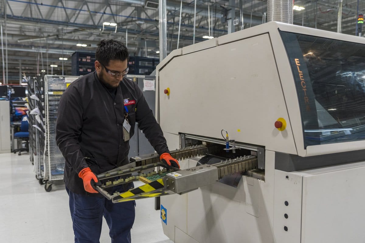 Skilled technician operating precision assembly equipment at an aerospace manufacturer in Guaymas | Tetakawi