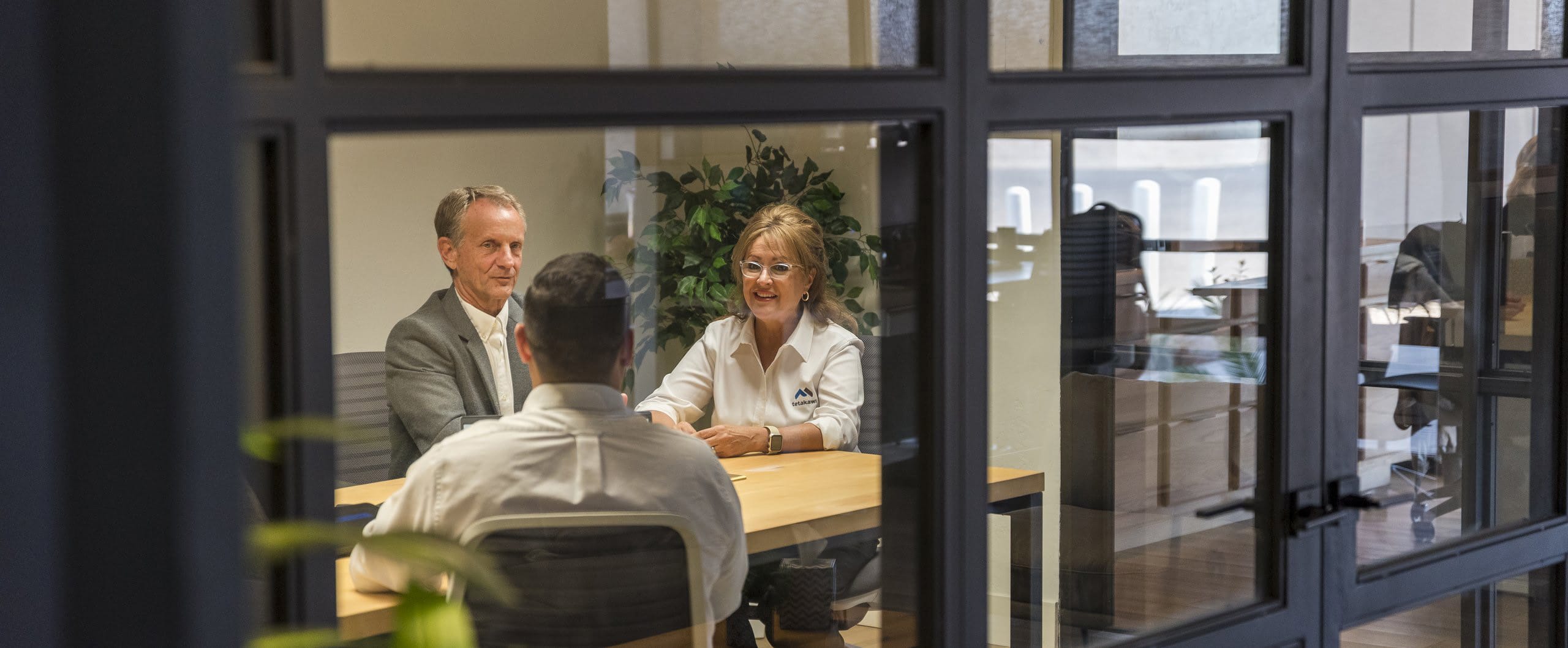 Tetakawi team members in a consultation meeting, discussing a path to manufacturing in Mexico | Tetakawi