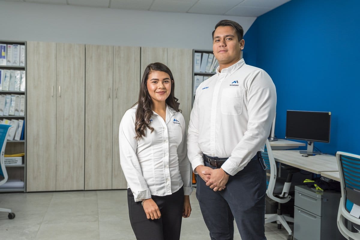 Tetakawi team members collaborating in a modern Sonora office to support shelter services in Hermosillo | Tetakawi